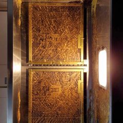 Example: range hood grease filters clogged with grease before cleaning. Illustration.