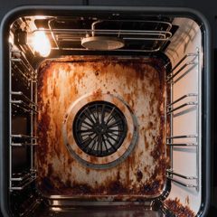 Example: oven back wall before cleaning. Illustration.