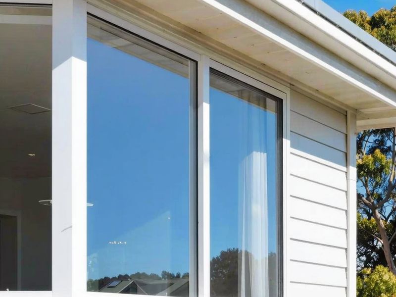 Clean exterior windows on a weatherboard house. Illustration.